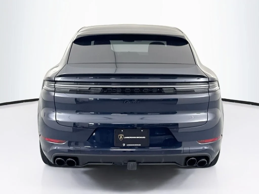 2025 Porsche Cayenne Turbo E-Hybrid Coupe, rear three-quarter view, Blue