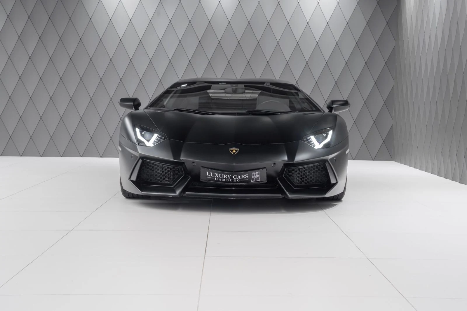 Matte black Lamborghini Aventador LP 700-4, full front view