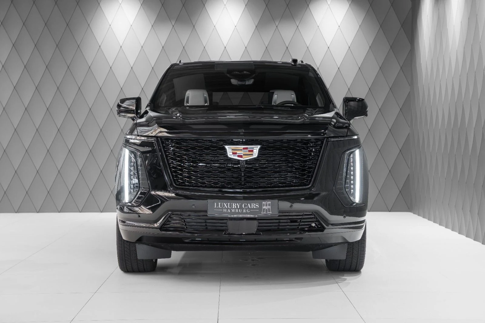 Black Cadillac Escalade ESV Sport Platinum, full front view