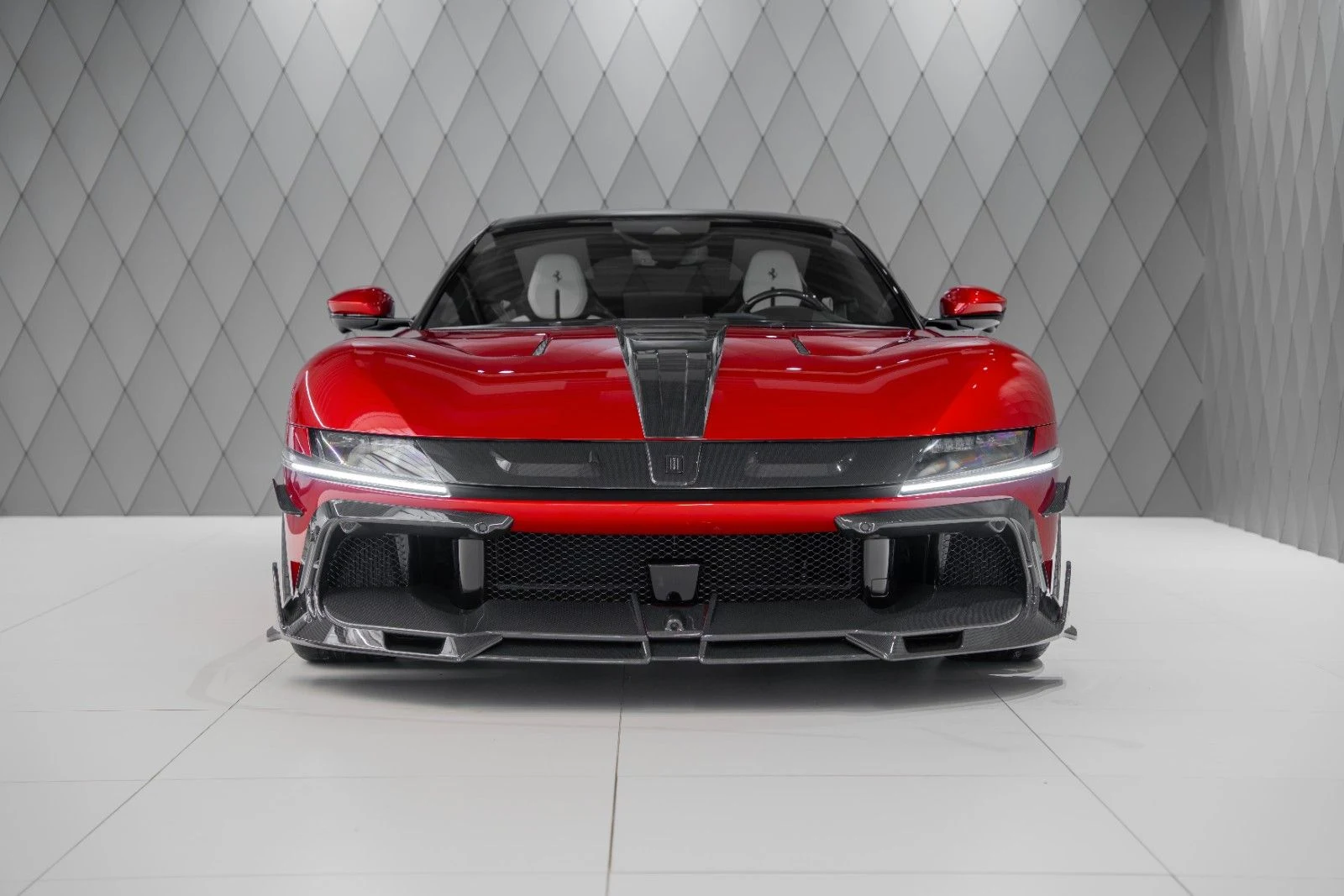 Red and carbon Ferrari 12Cilindri MANSORY, full front view