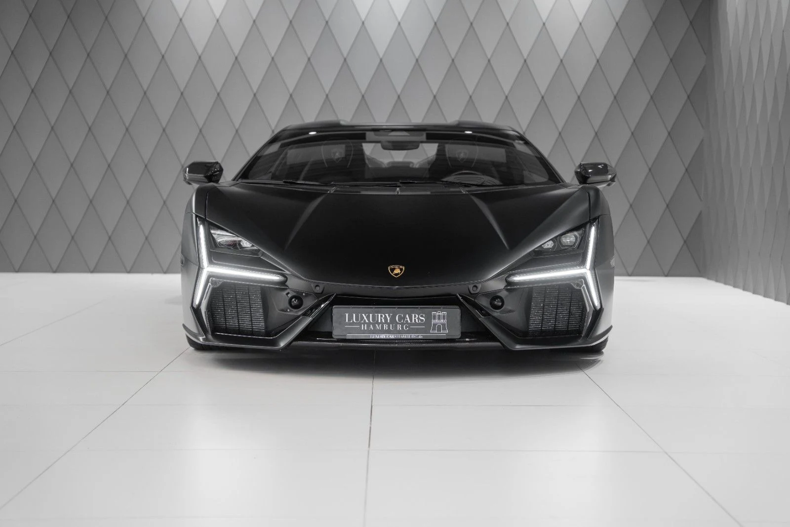 Matte black Lamborghini Revuelto, full front view