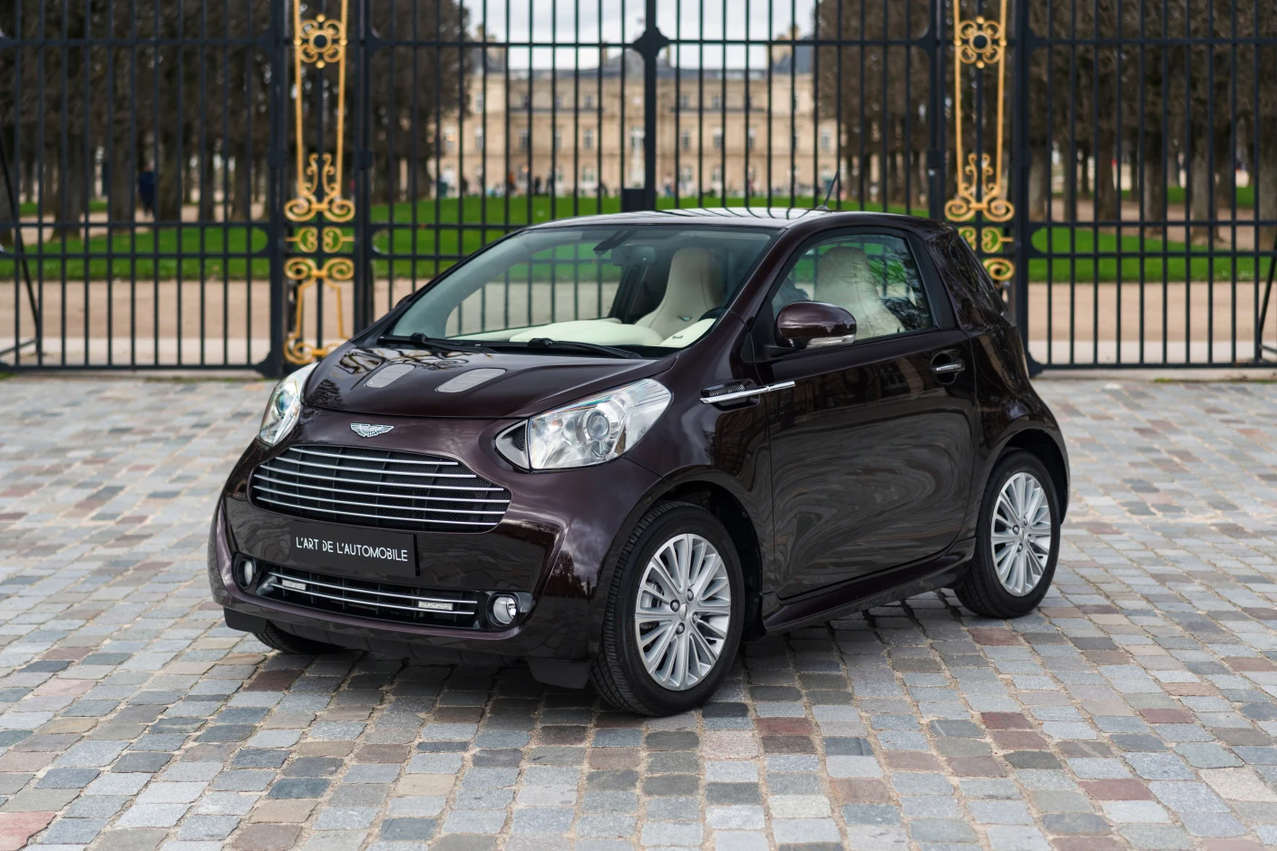 Red Aston Martin Cygnet, full front three-quarter view