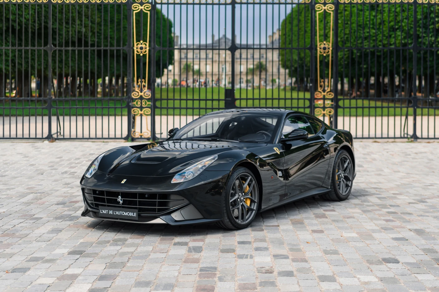 Black Ferrari F12berlinetta, full front three-quarter view