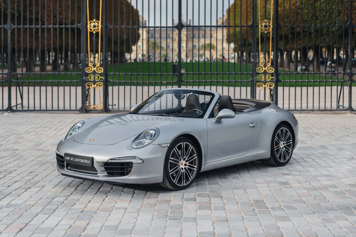 Silver Porsche 911 Carrera S Cabriolet (991), full front three-quarter view