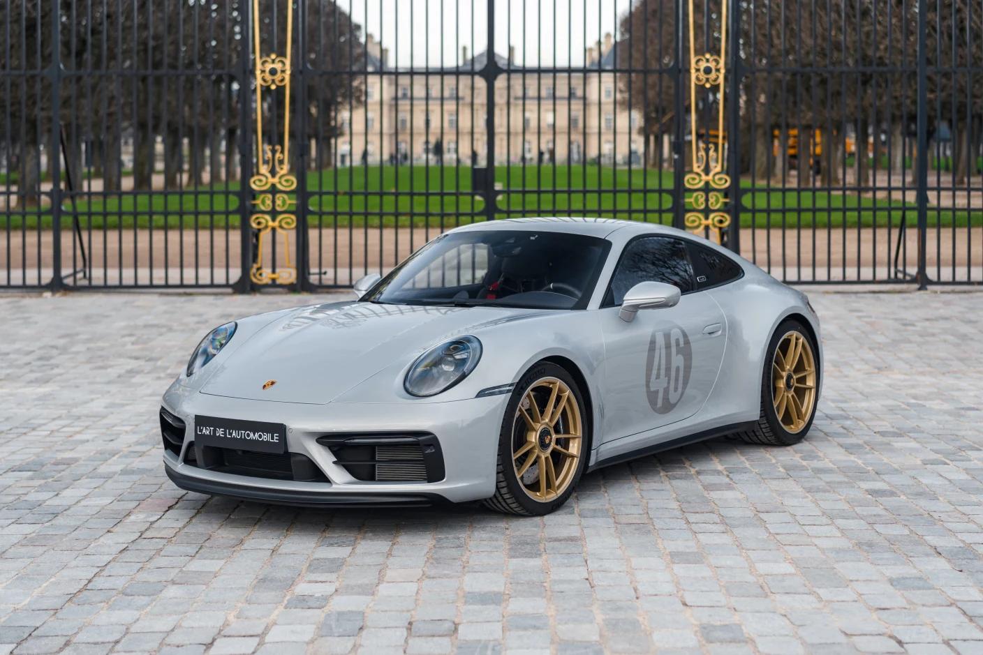 Silver Porsche 911 Carrera GTS Le Mans Centenaire Edition, full front three-quarter view