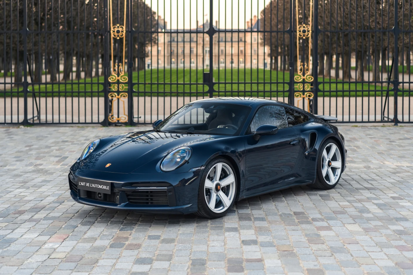 Blue Porsche 911 Turbo 50 Years (992), full front three-quarter view