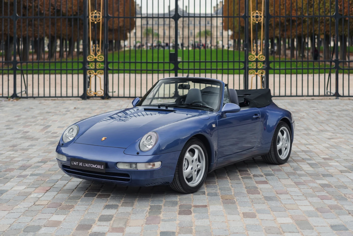 Blue Porsche 911 Carrera 4 Cabriolet (993), full front three-quarter view
