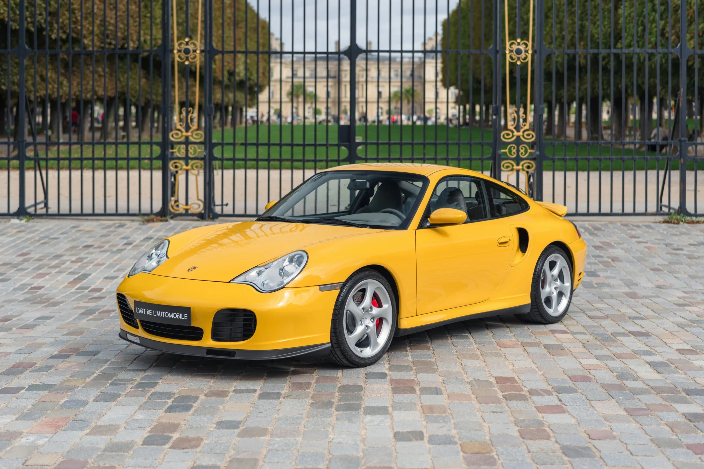 Yellow Porsche 911 Turbo (996), full front three-quarter view