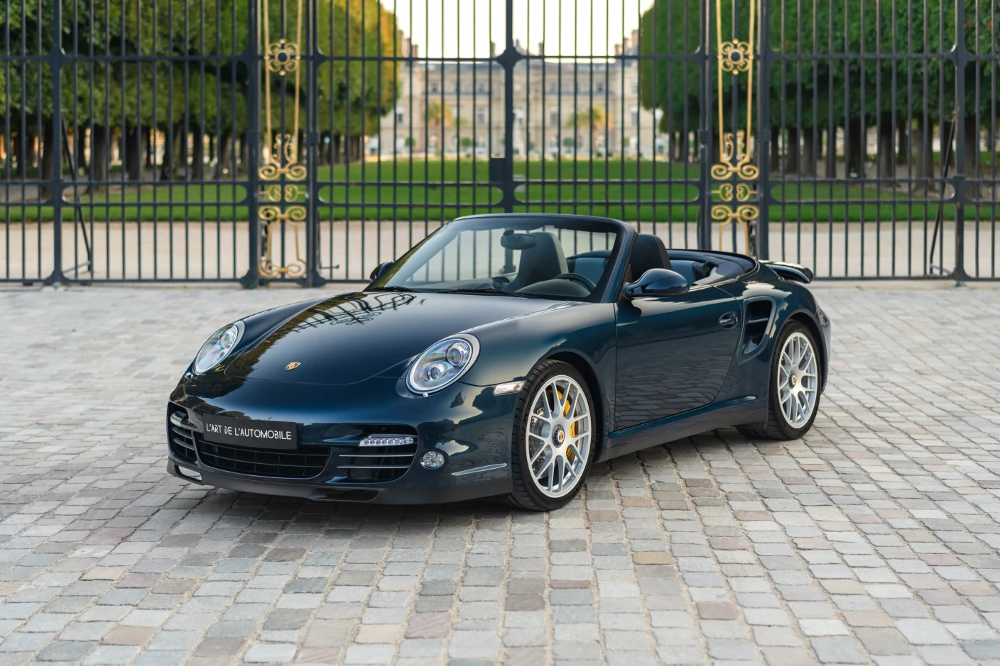 Blue Porsche 911 Turbo S Cabriolet (997), full front three-quarter view