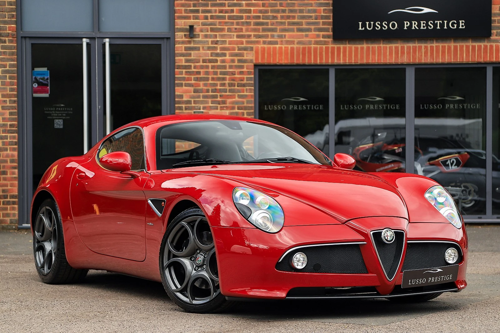 Red Alfa Romeo 8C Competizione, full front three-quarter view