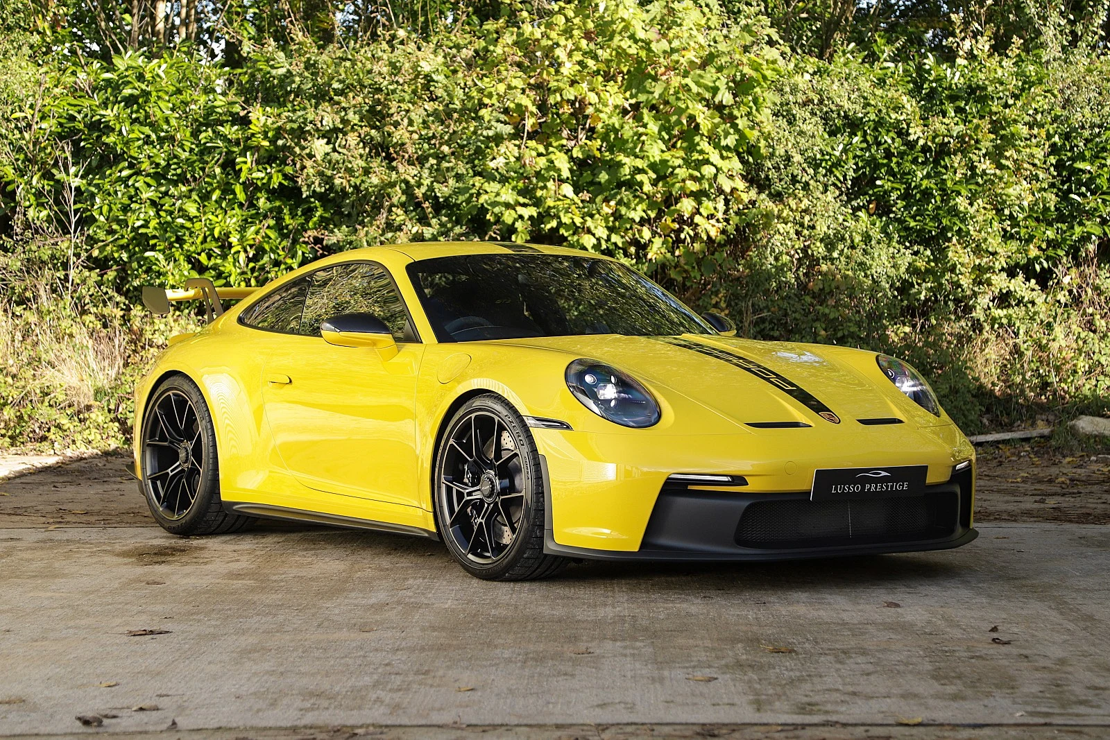 Yellow Porsche 911 GT3, full front three-quarter view