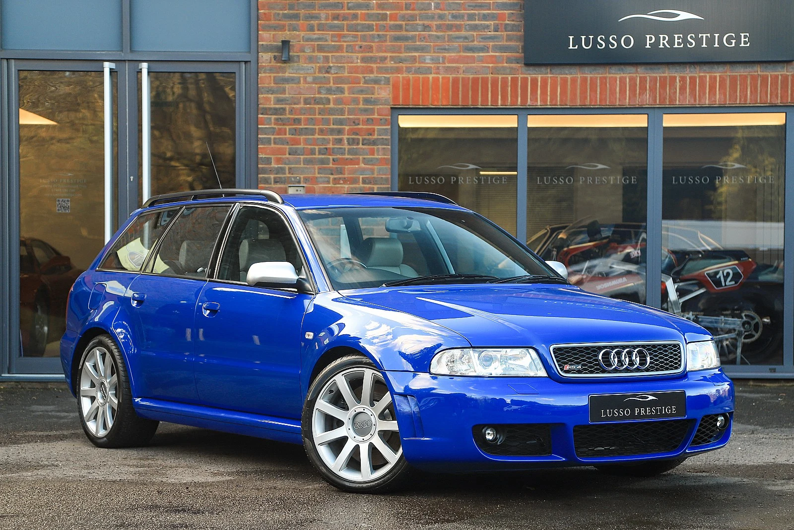 Blue Audi RS4 Avant, full front three-quarter view