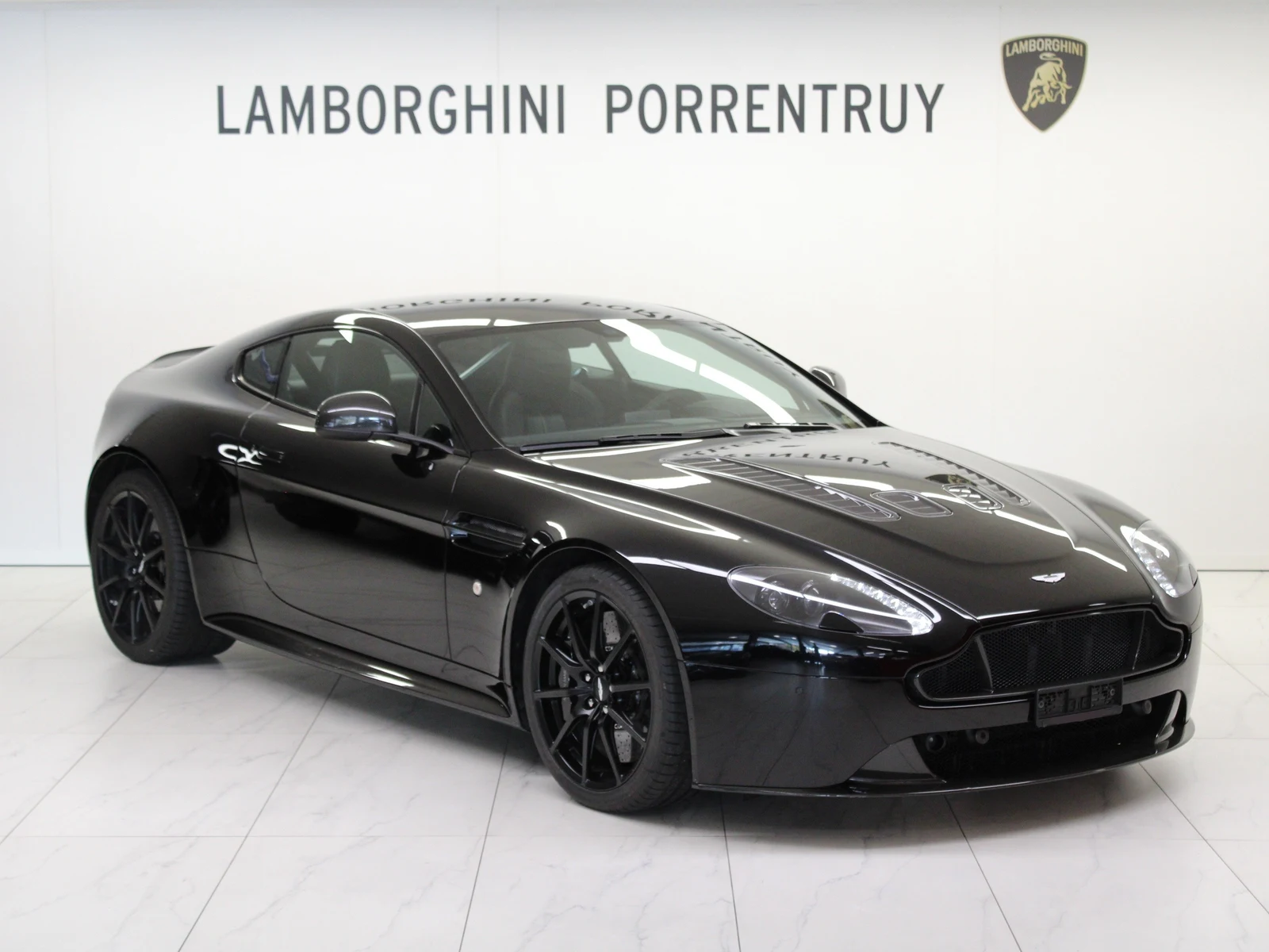 Black Aston Martin V12 Vantage S, full front three-quarter view