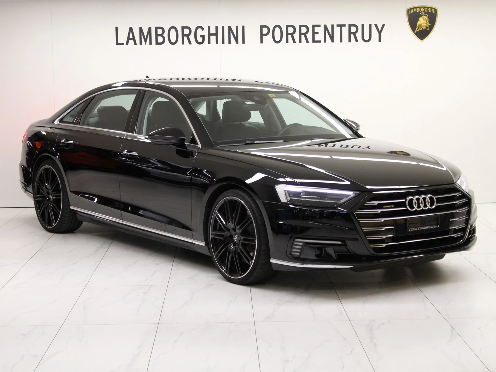 Black Audi A8 L 60 TFSI e quattro, full front three-quarter view
