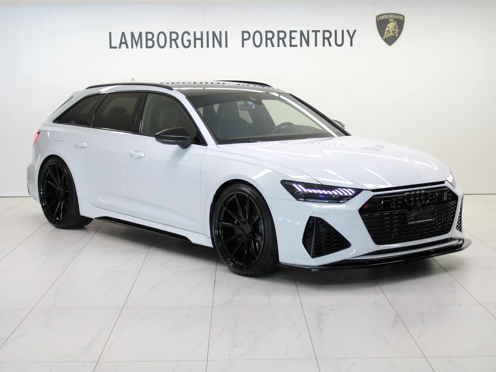 White Audi RS 6 Avant Performance, full front three-quarter view