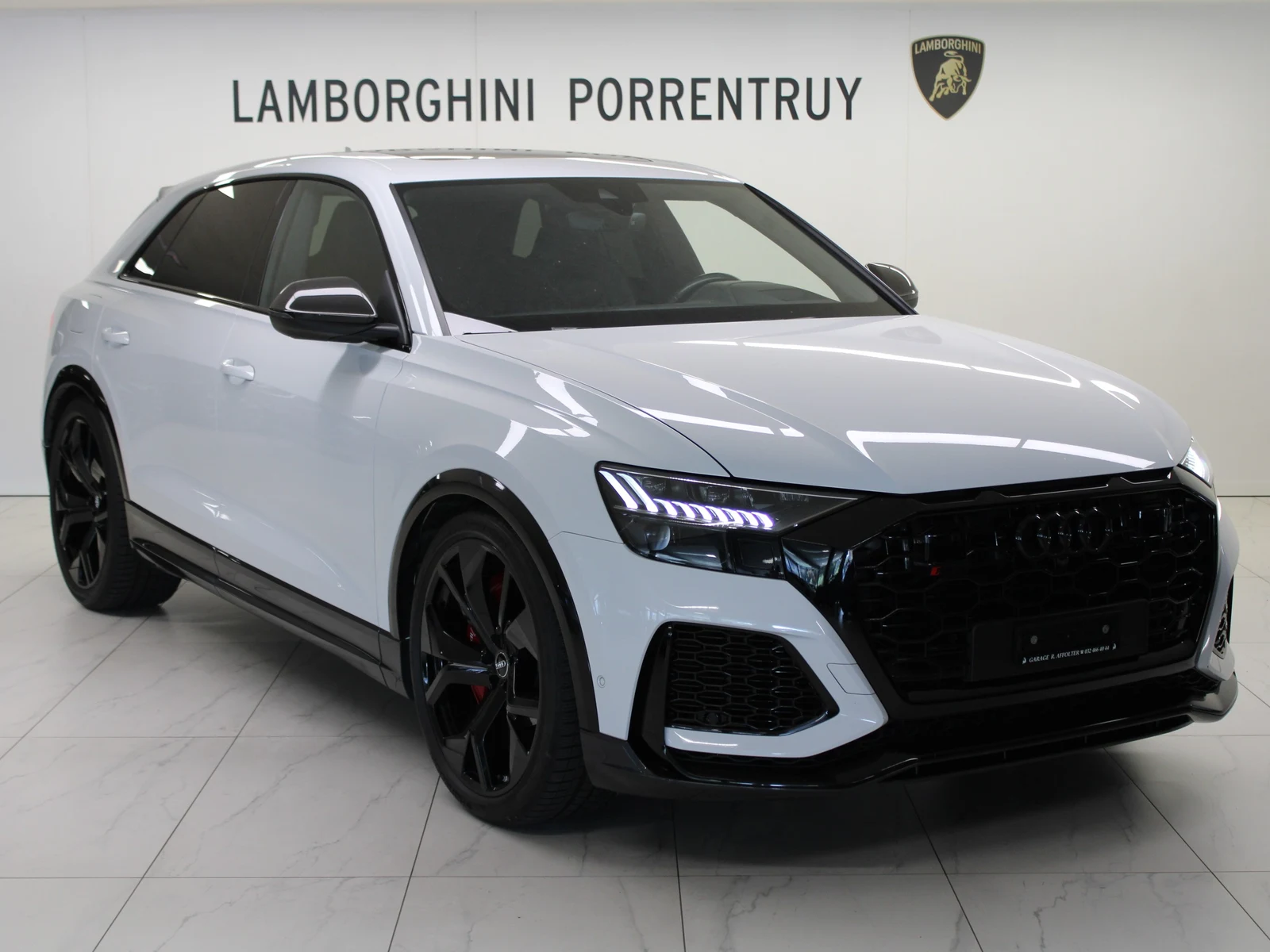 White Audi RS Q8, full front three-quarter view