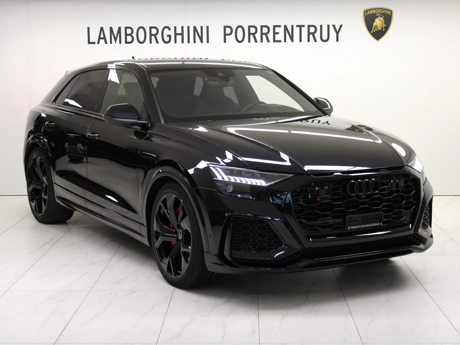 Black Audi RS Q8, full front three-quarter view