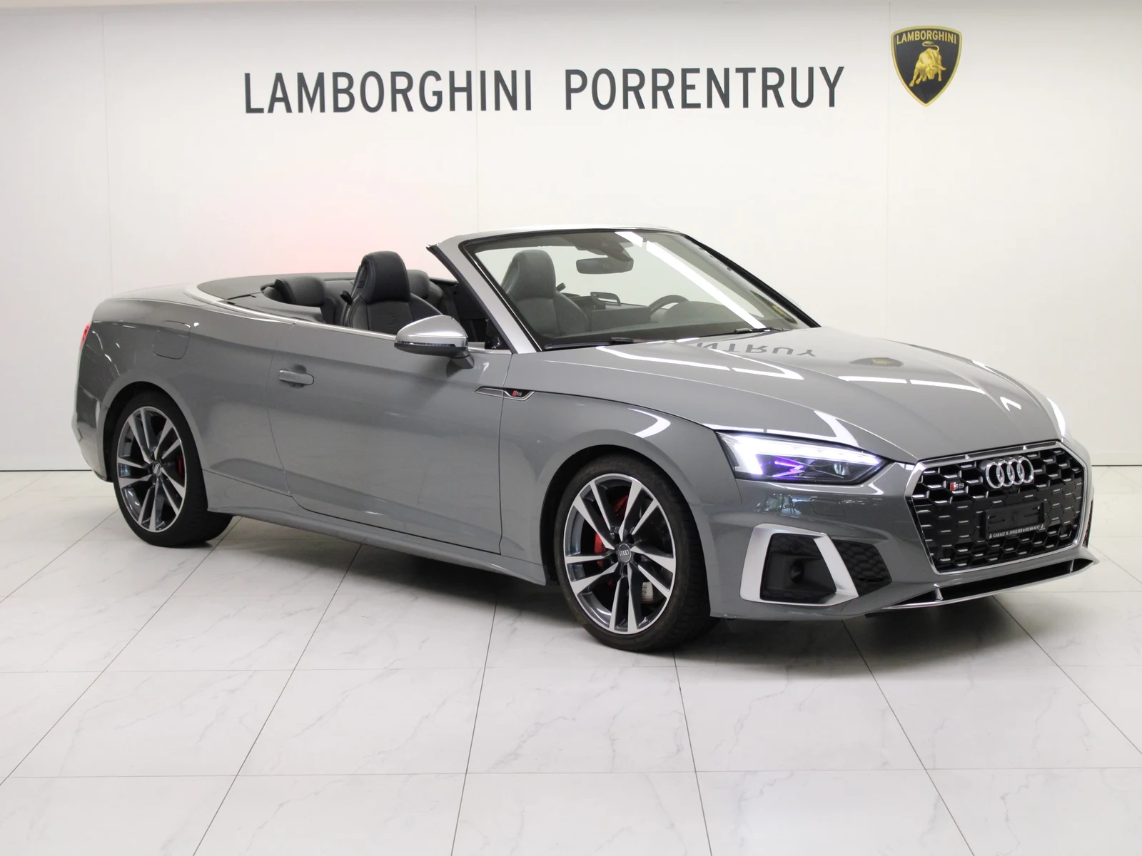 Gray Audi S5 Cabriolet, full front three-quarter view