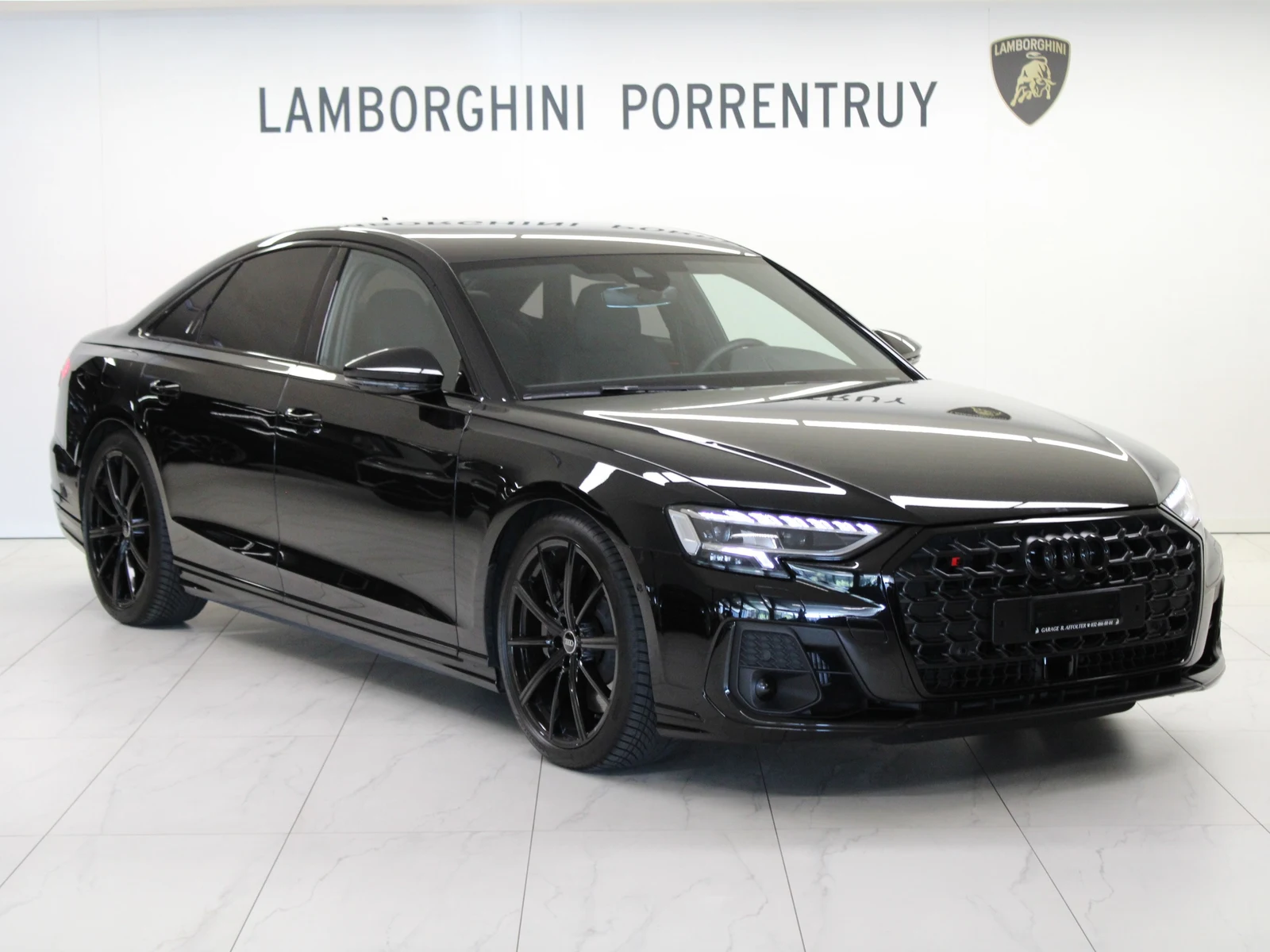 Black Audi S8, full front three-quarter view