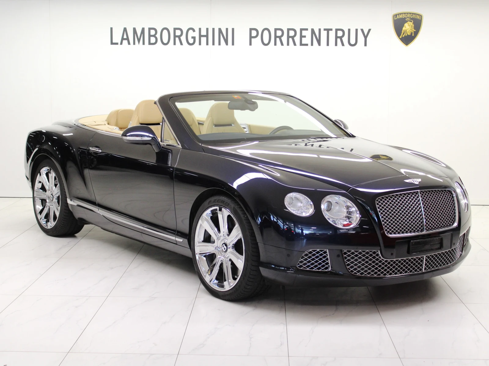 Blue Bentley Continental GTC W12, full front three-quarter view