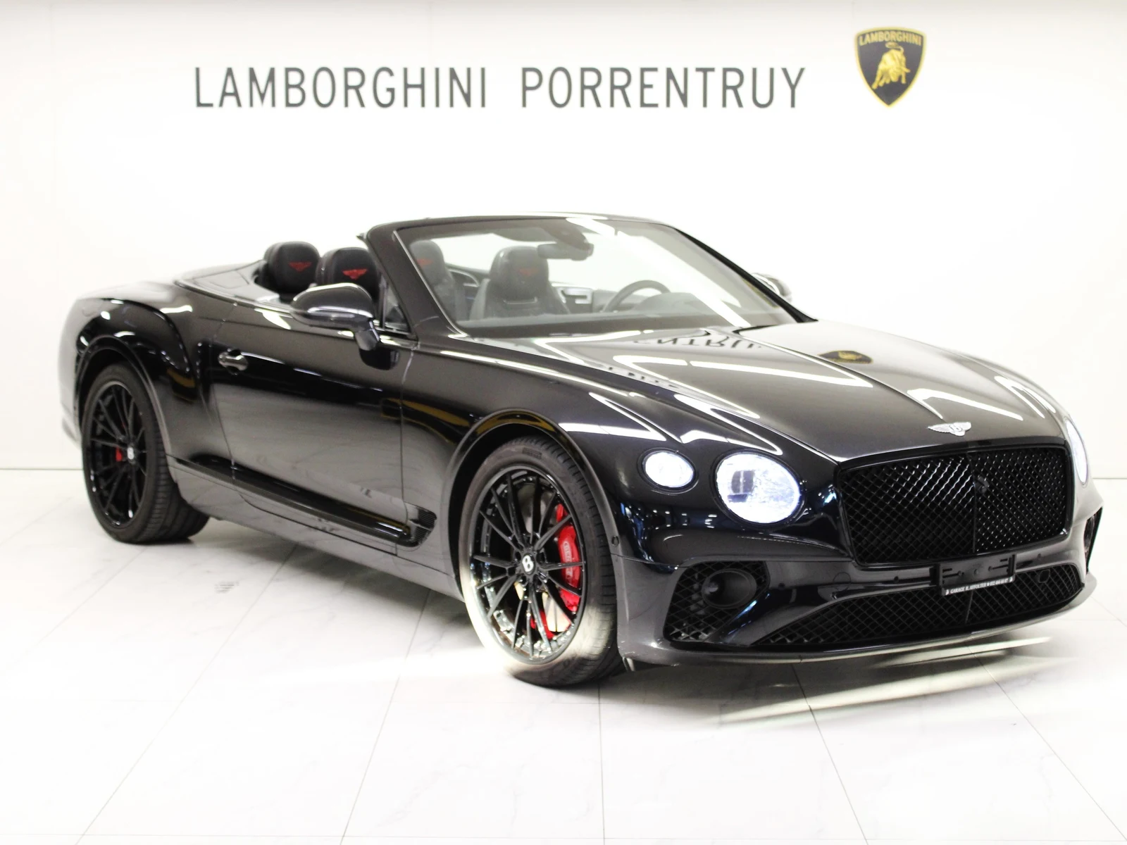 Black Bentley Continental GTC Speed W12, full front three-quarter view