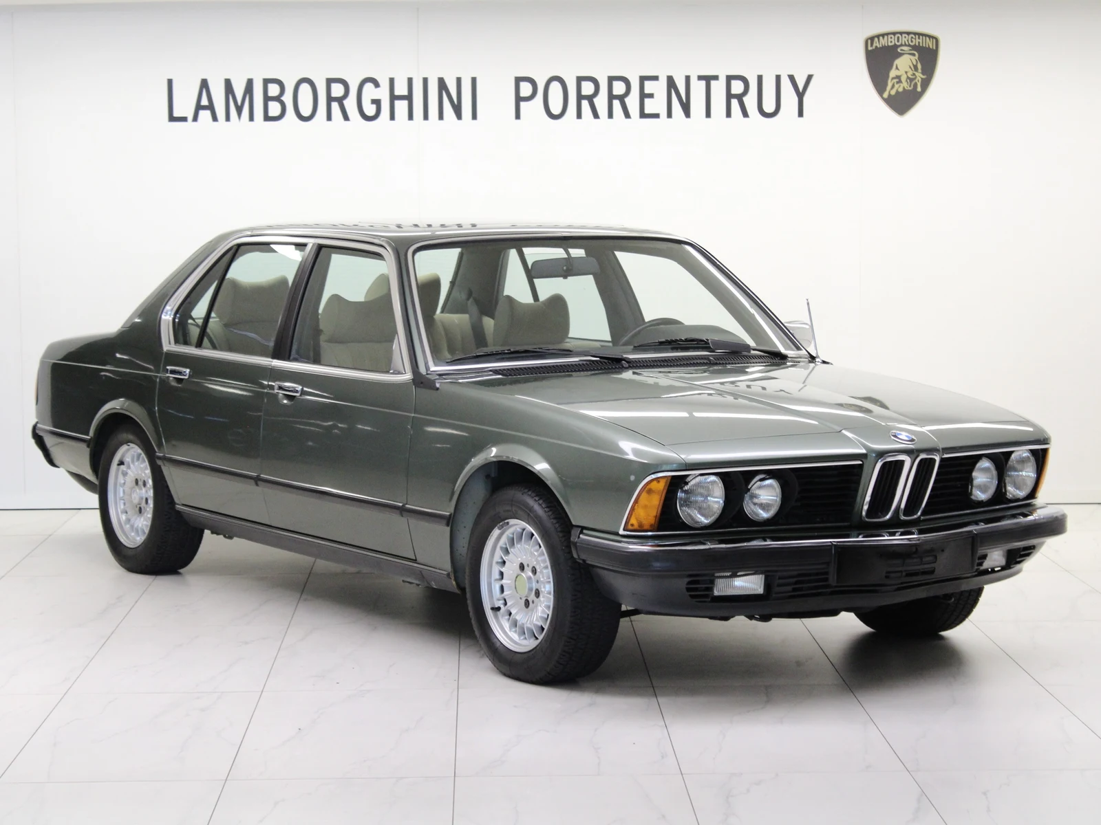 Gray BMW 745i (E23), full front three-quarter view