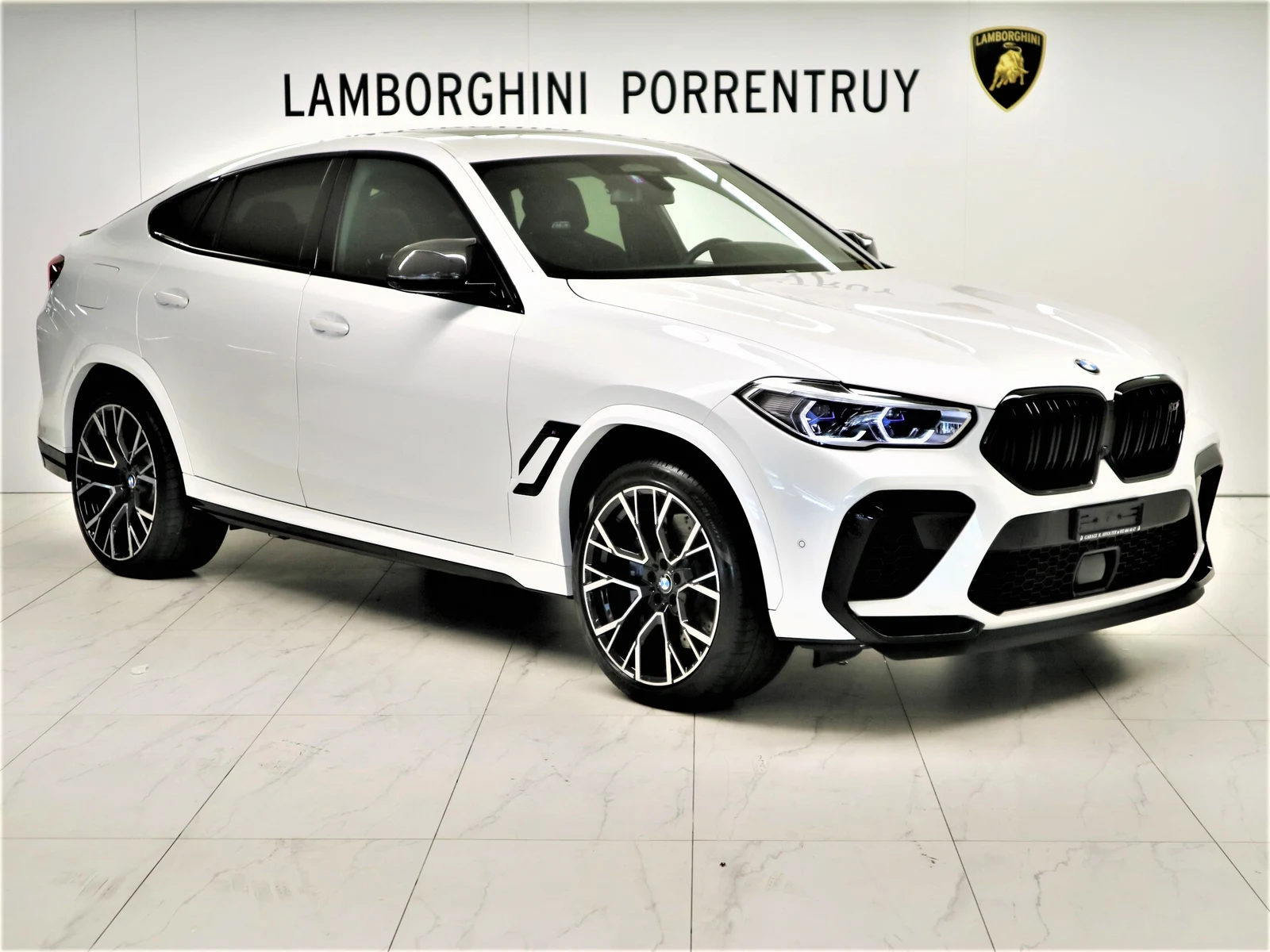 White BMW X6 M Competition, full front three-quarter view