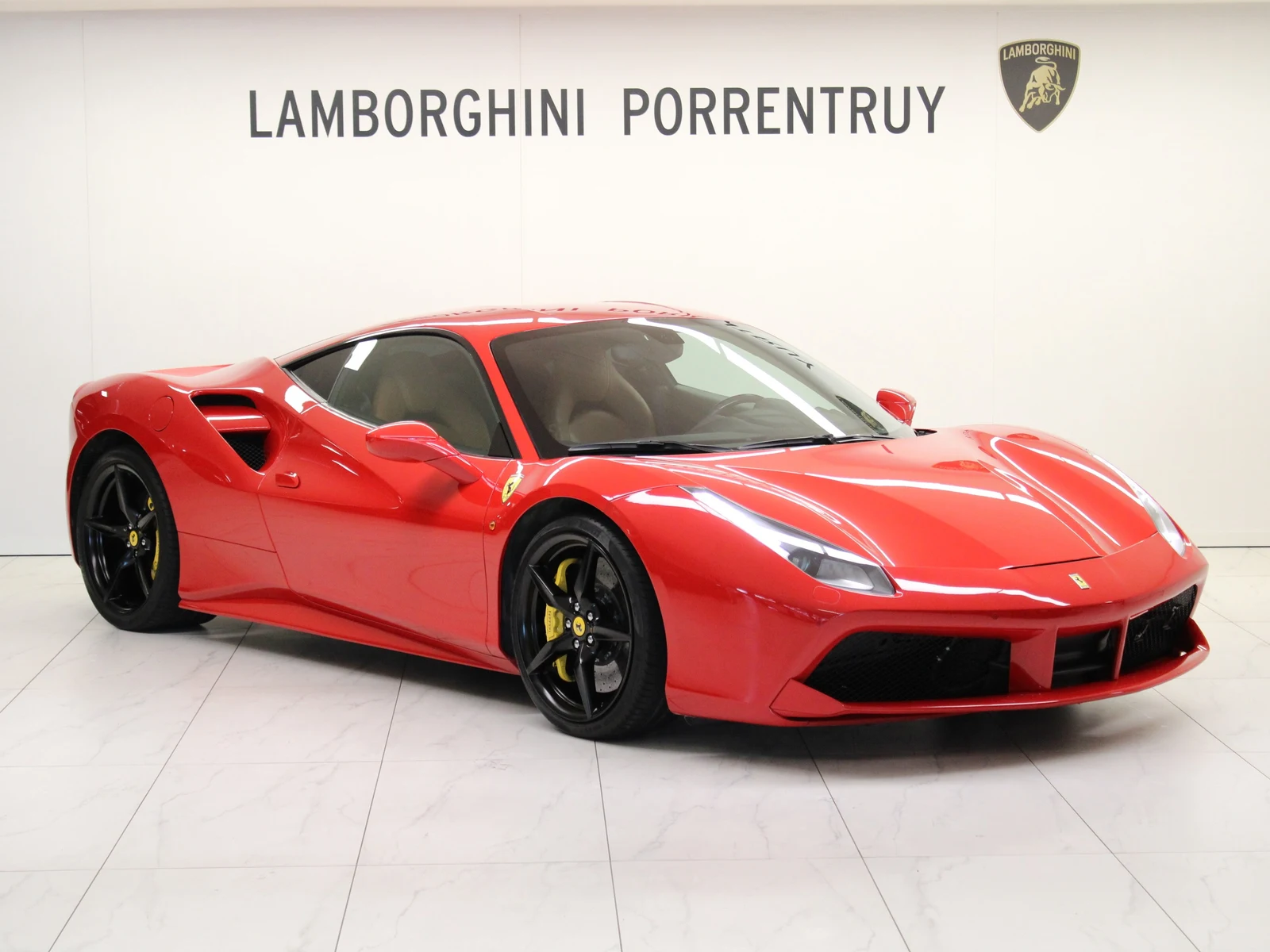 Red Ferrari 488 GTB, full front three-quarter view