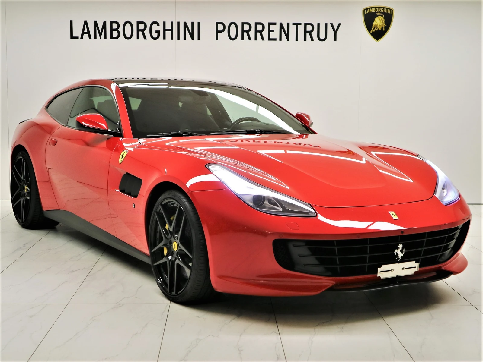Red Ferrari GTC4Lusso, full front three-quarter view