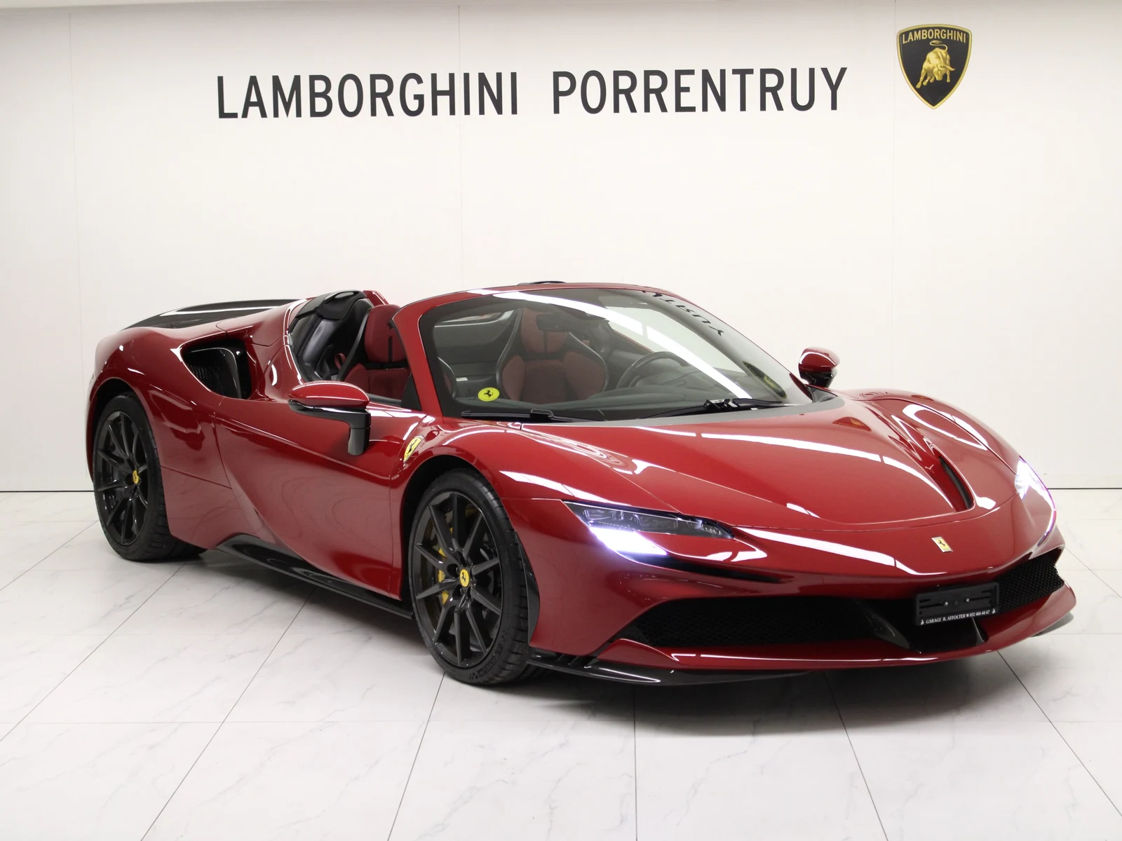 Red Ferrari SF90 Spider Assetto Fiorano, full front three-quarter view