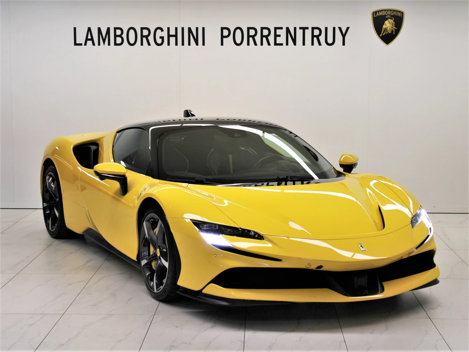 Yellow Ferrari SF90 Stradale, full front three-quarter view