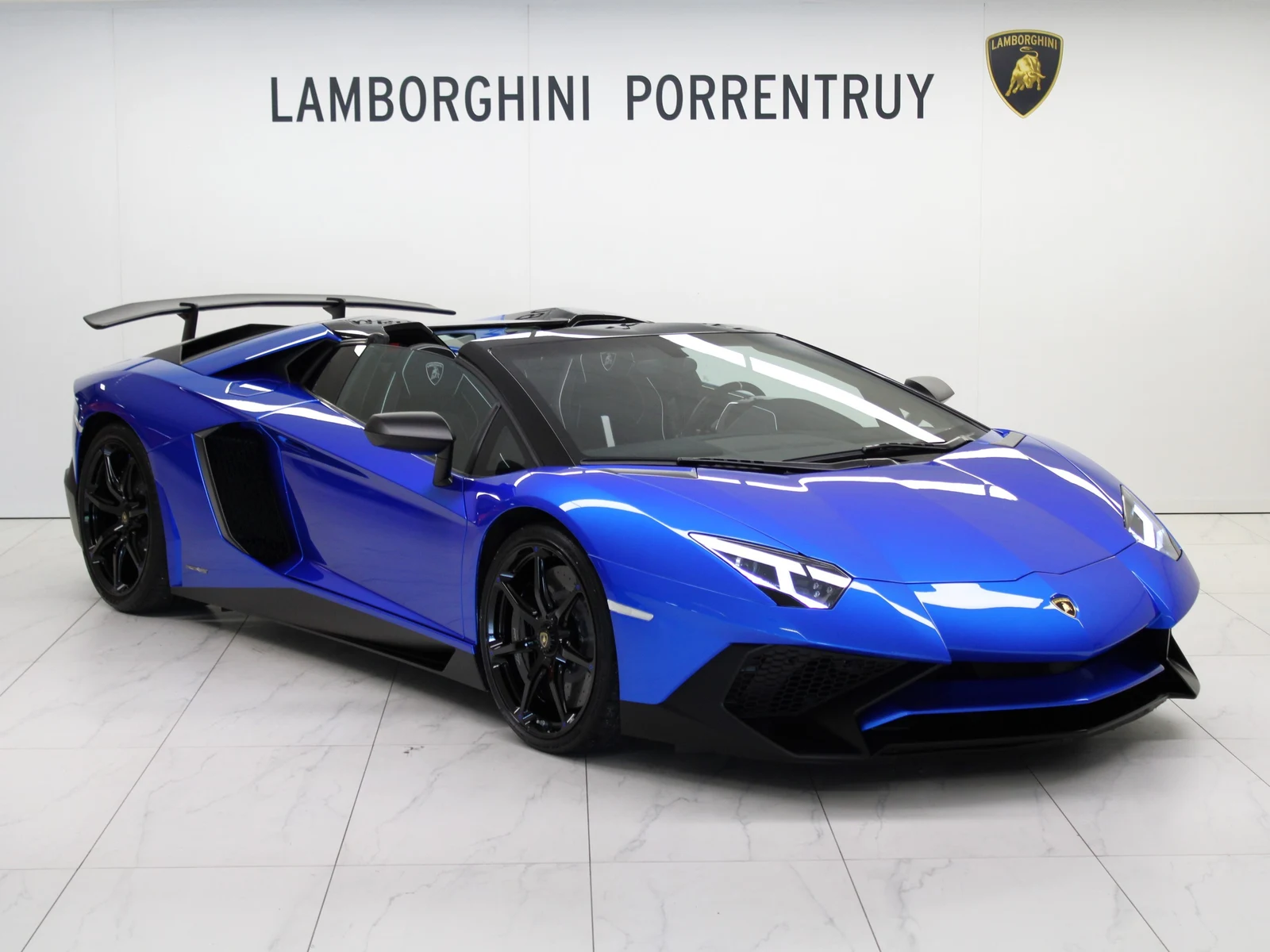 Blue Lamborghini Aventador LP 750-4 SV Roadster, full front three-quarter view