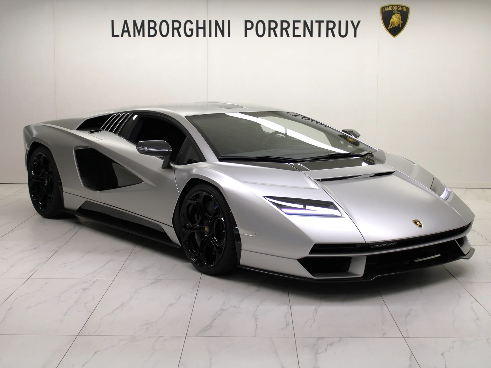 Gray Lamborghini Countach LPI 800-4, full front three-quarter view