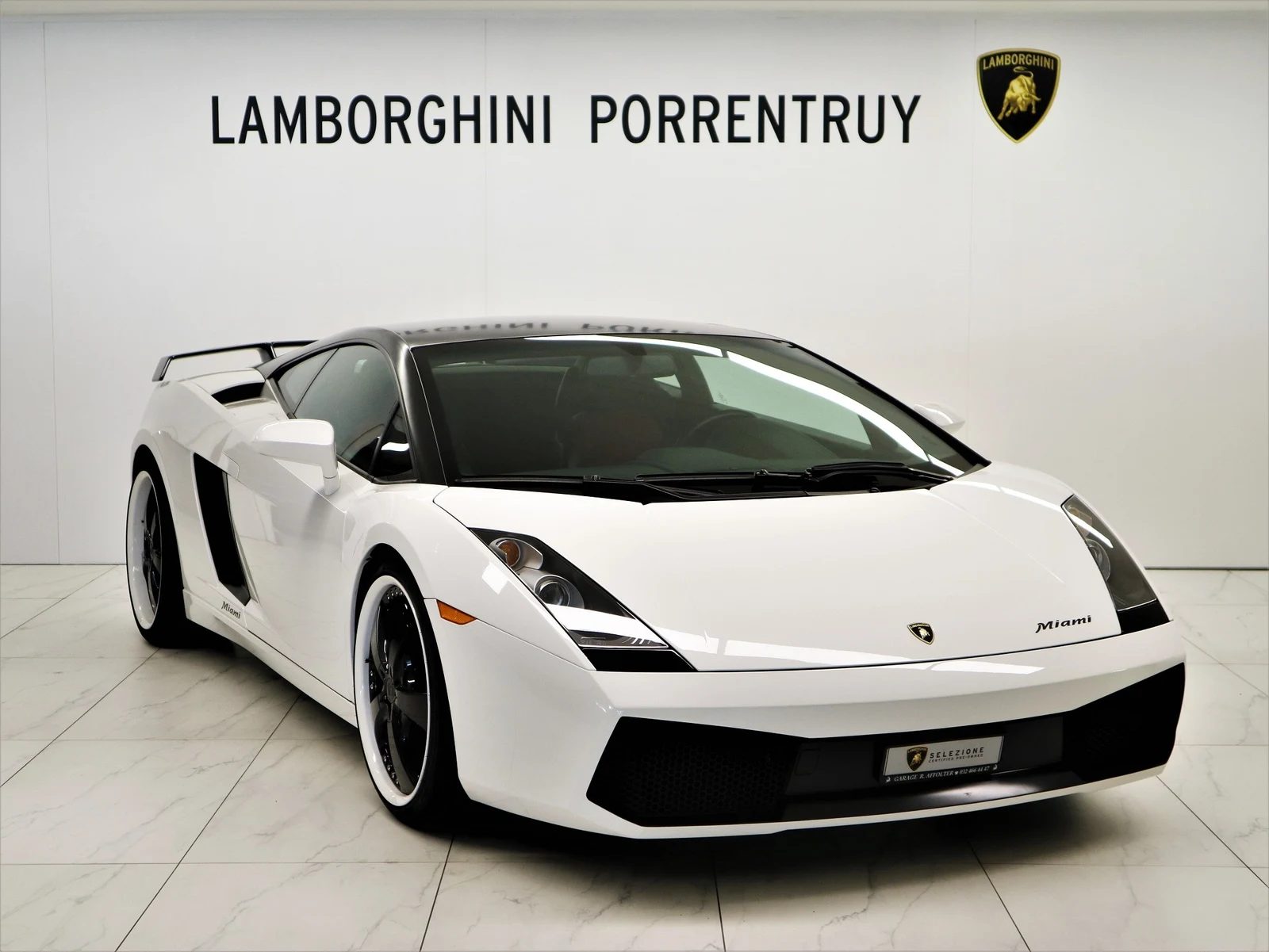 White Lamborghini Gallardo, full front three-quarter view