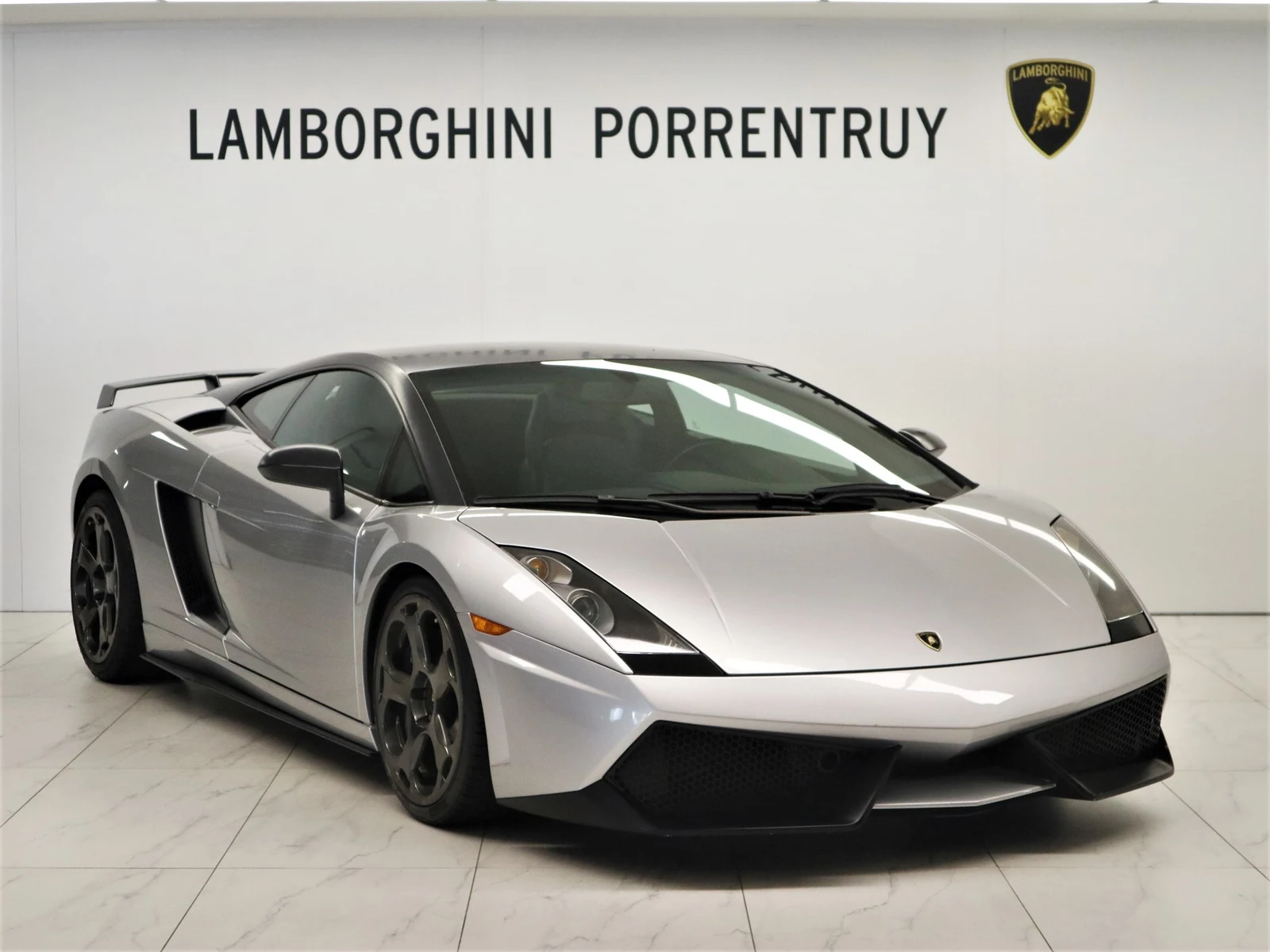 Gray Lamborghini Gallardo, full front three-quarter view