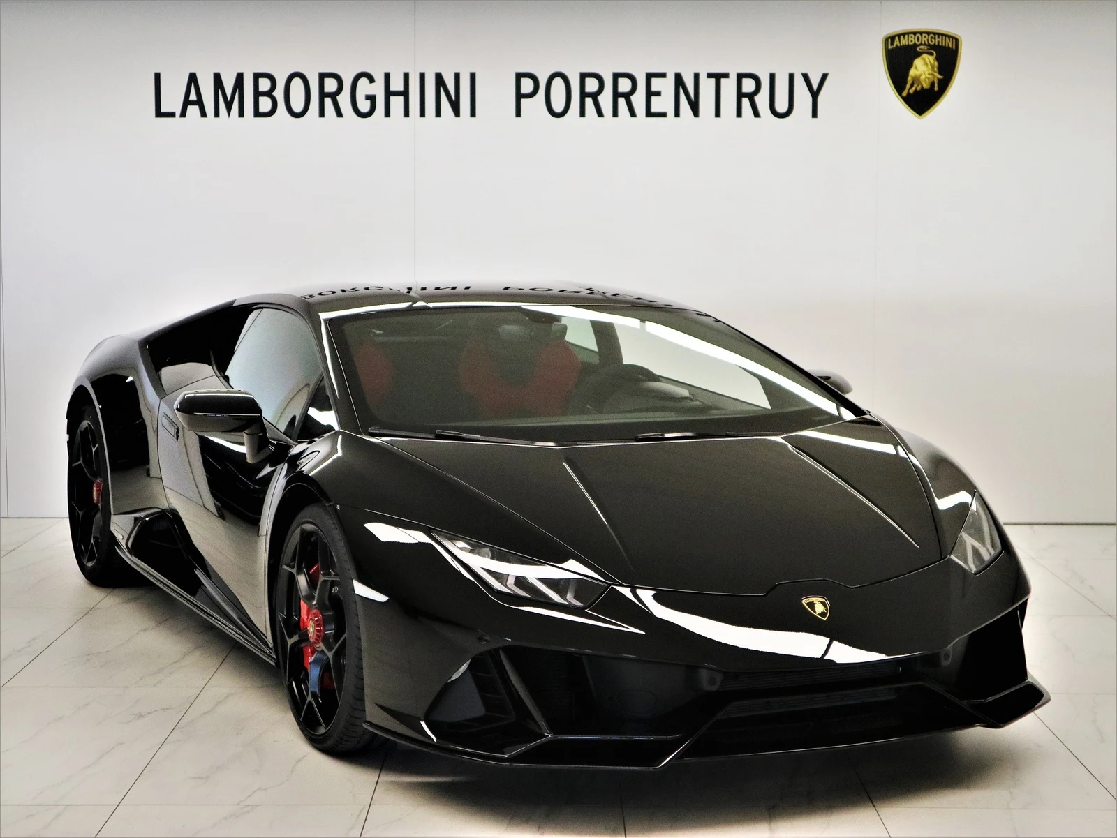 Black Lamborghini Huracán EVO, full front three-quarter view