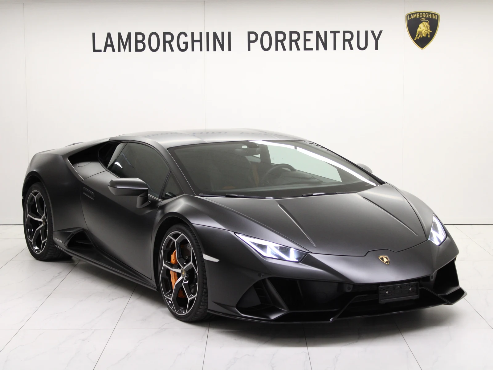 Black Lamborghini Huracán EVO, full front three-quarter view
