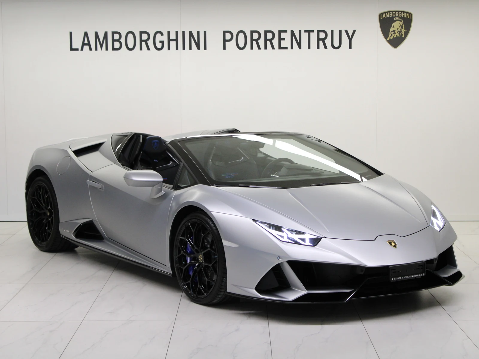Gray Lamborghini Huracán EVO Spyder, full front three-quarter view