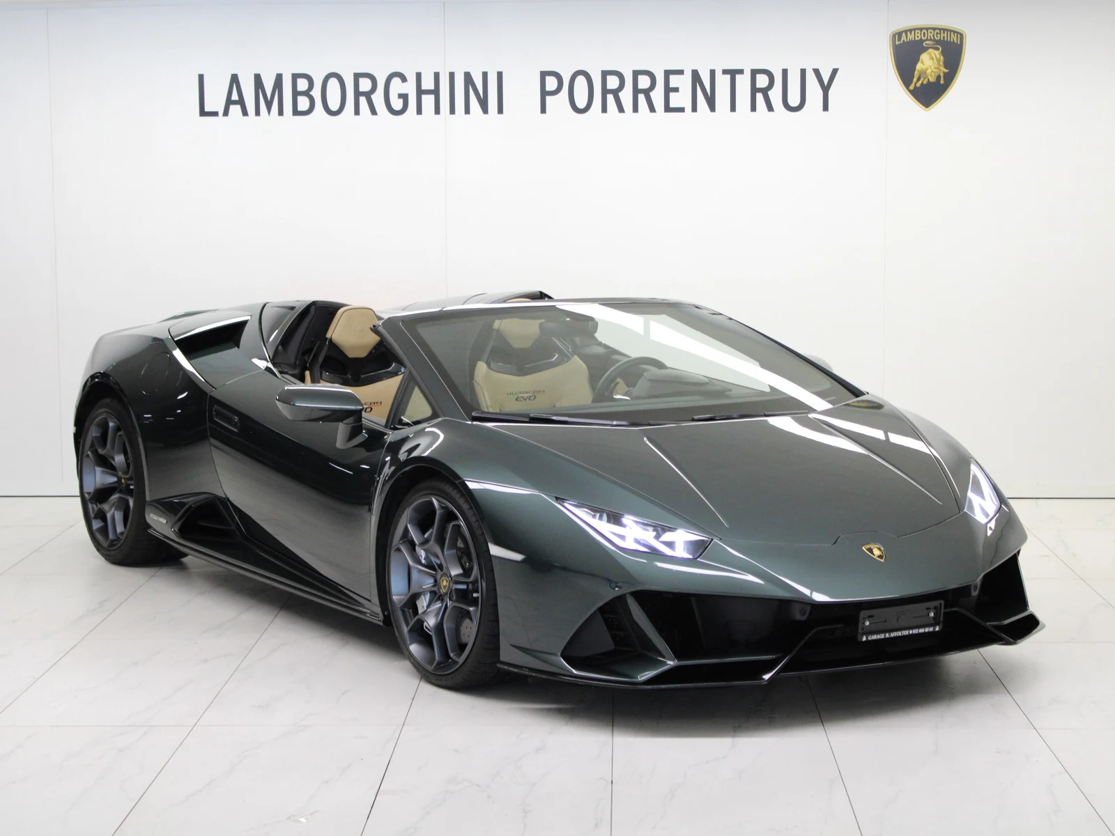 Green Lamborghini Huracán EVO Spyder, full front three-quarter view