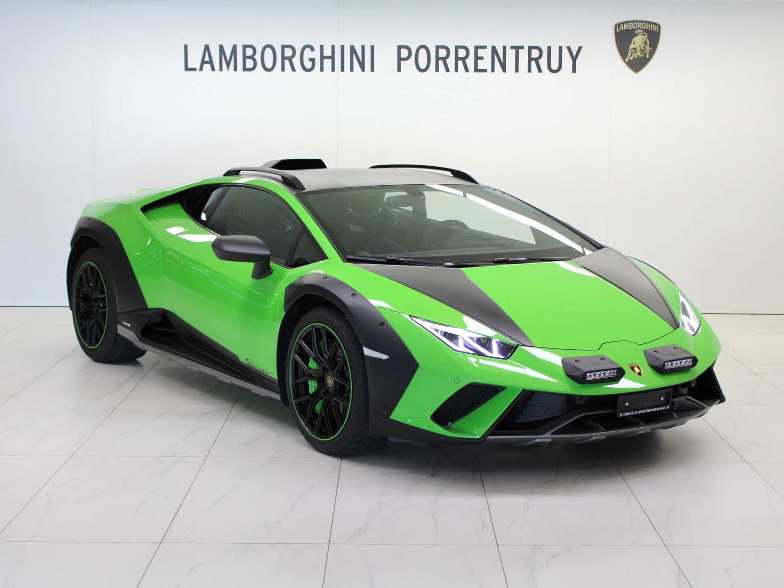 Green Lamborghini Huracán Sterrato, full front three-quarter view