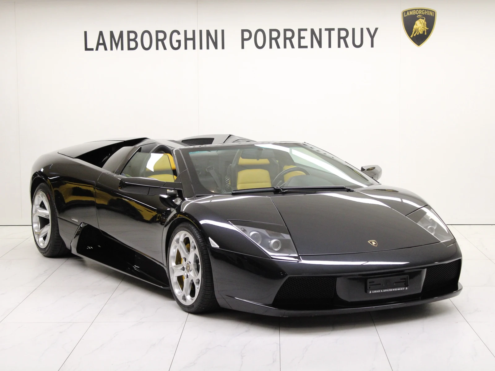 Black Lamborghini Murciélago Roadster, full front three-quarter view