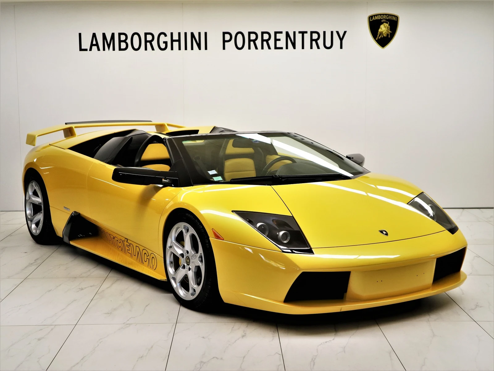 Yellow Lamborghini Murciélago Roadster, full front three-quarter view