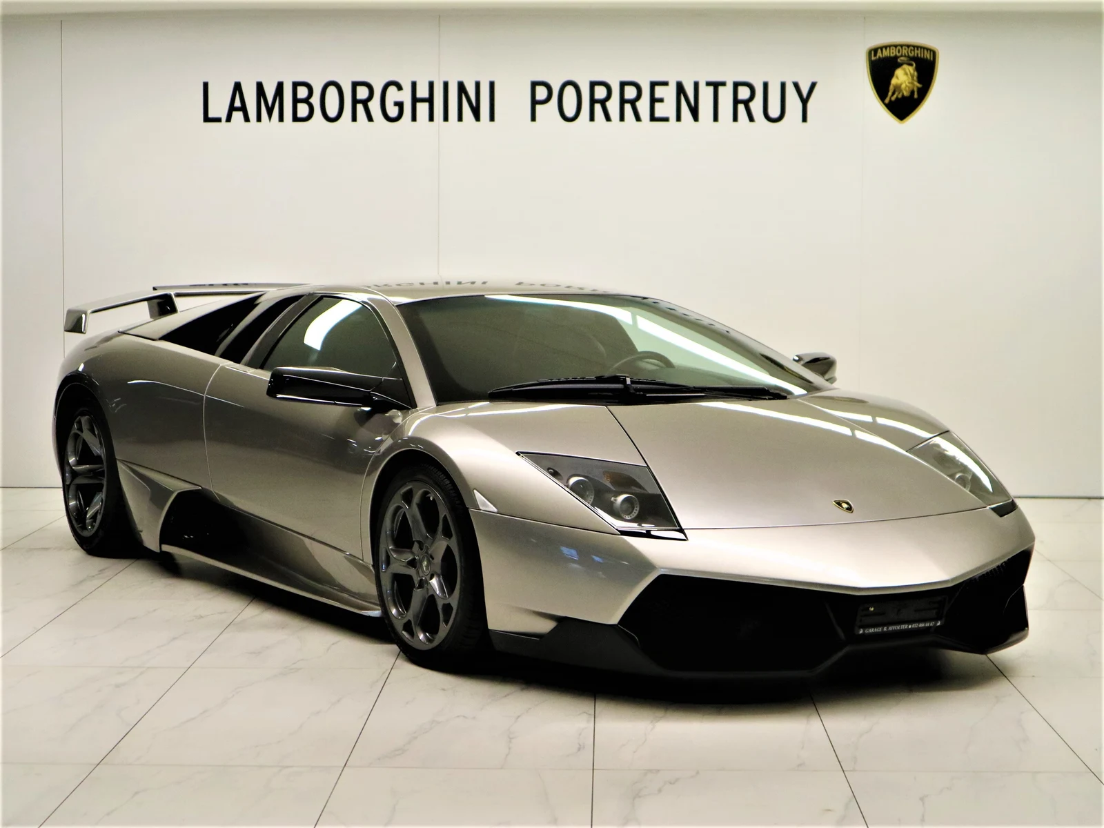 Gray Lamborghini Murciélago LP 640, full front three-quarter view