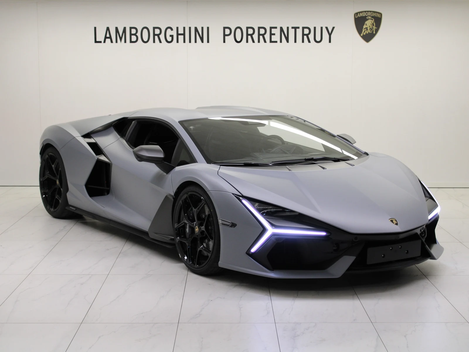 Gray Lamborghini Revuelto, full front three-quarter view