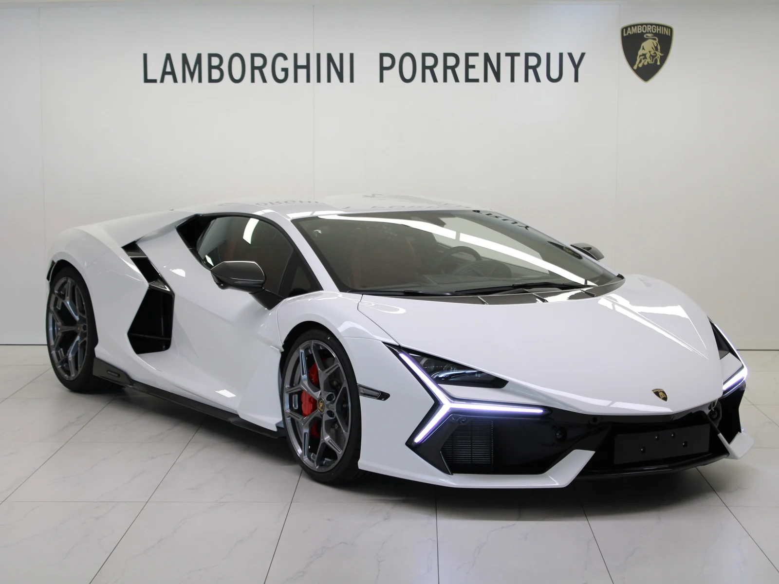 White Lamborghini Revuelto, full front three-quarter view