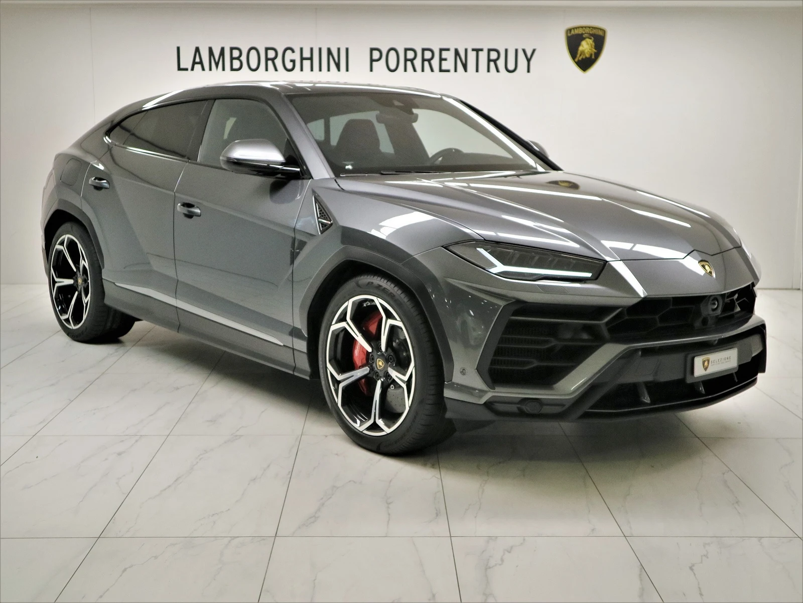 Anthracite gray Lamborghini Urus, full front three-quarter view