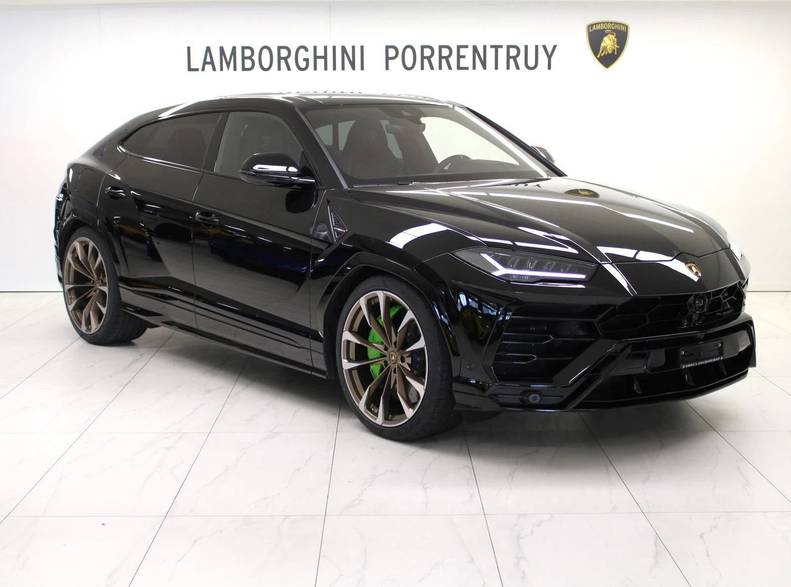 Black Lamborghini Urus, full front three-quarter view