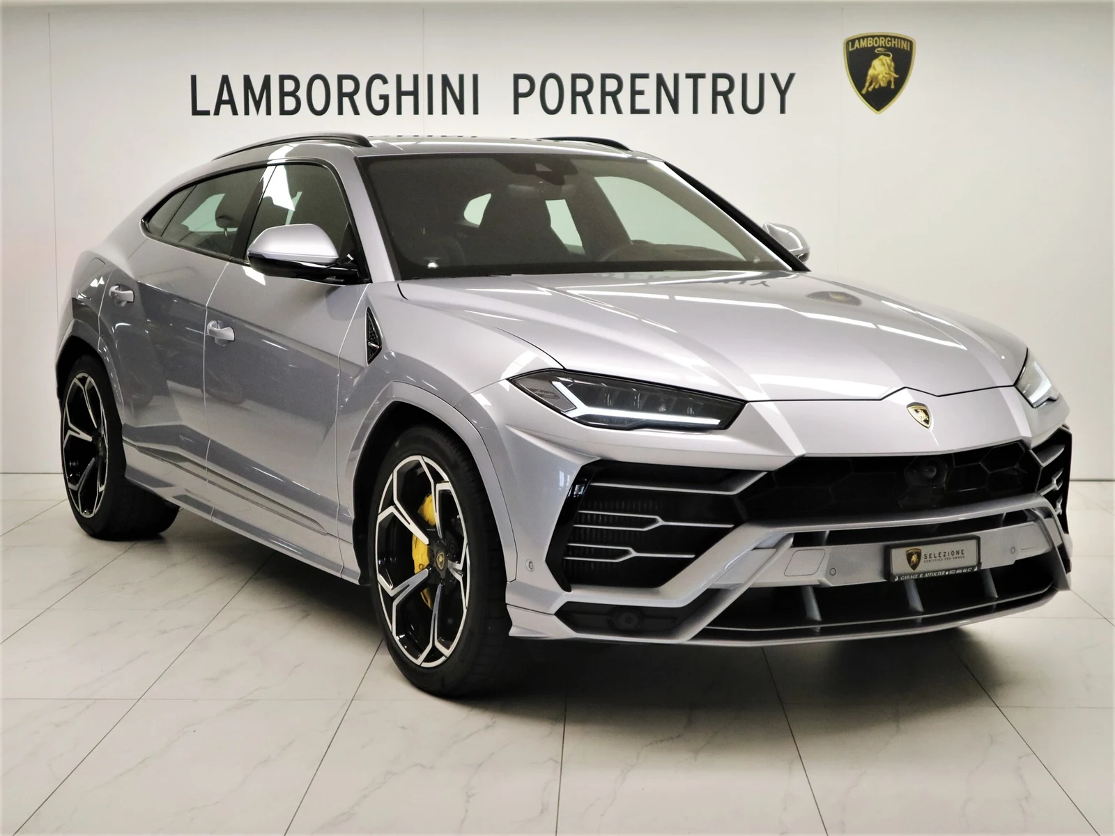 Silver Lamborghini Urus, full front three-quarter view