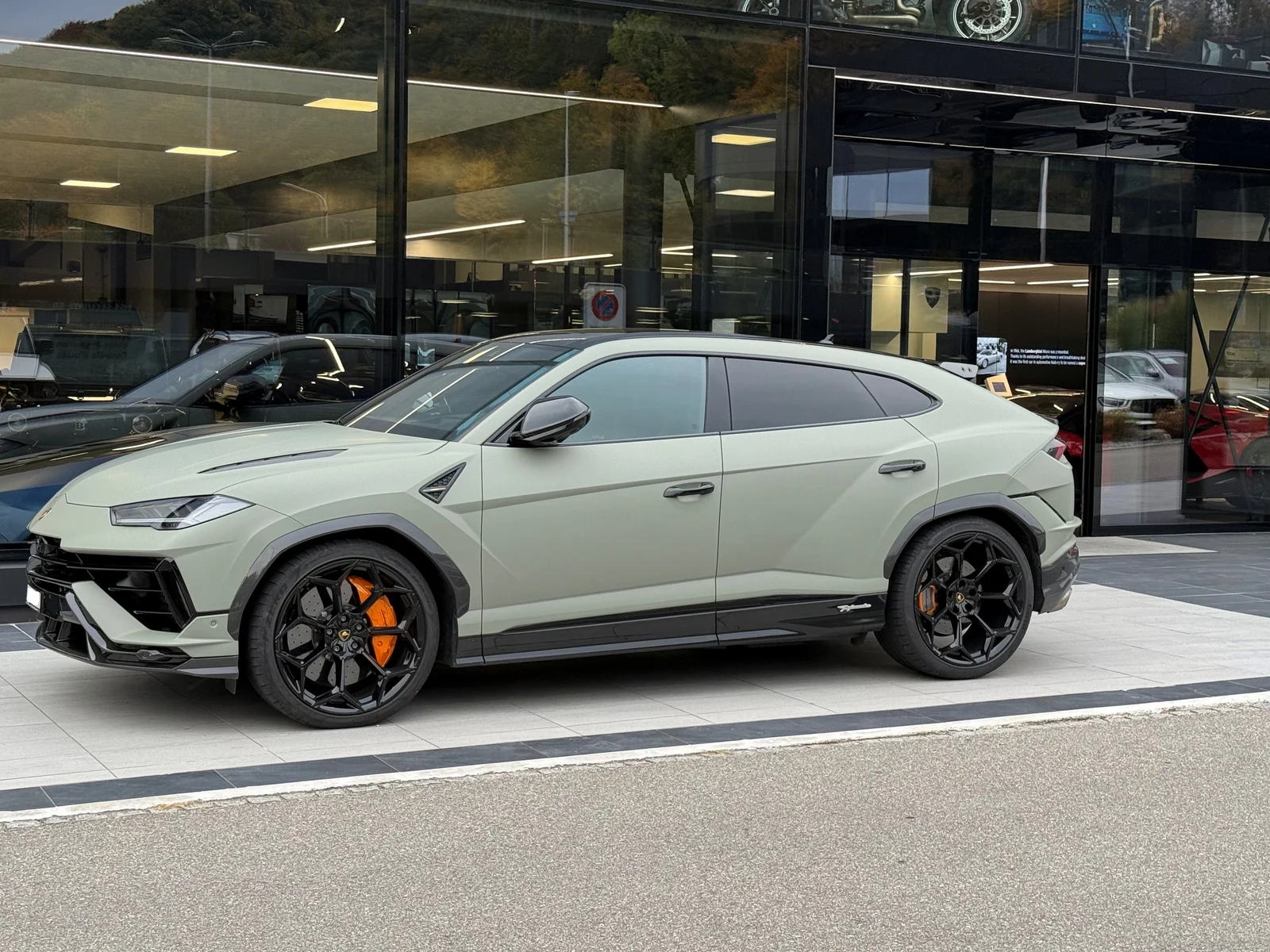 Green Lamborghini Urus Performante, full front three-quarter view