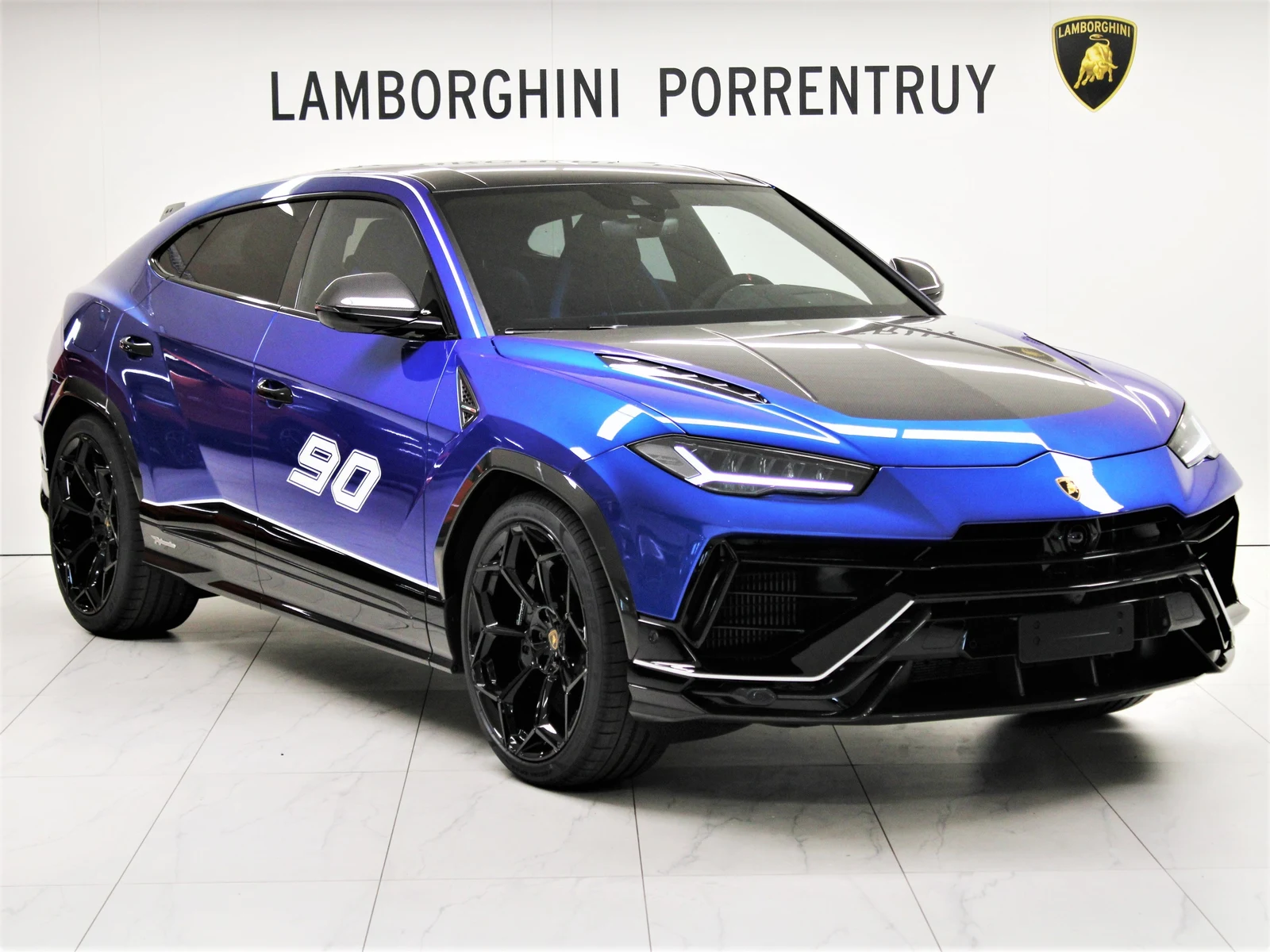 Blue Lamborghini Urus Performante, full front three-quarter view
